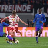 Calvin Bassey challenges Dani Olmo. (Photo by Maja Hitij/Getty Images)