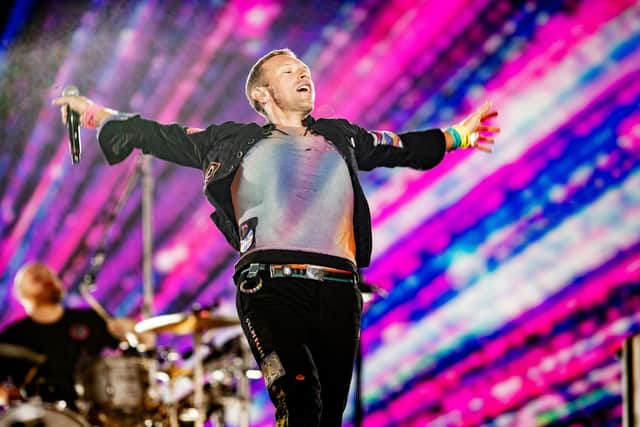 BUENOS AIRES, ARGENTINA - OCTOBER 25: Chris Martin of Coldplay performs during the first of ten shows as part of 'Music Of The Spheres World Tour' at Estadio Mas Monumental Antonio Vespucio Liberti on October 25, 2022 in Buenos Aires, Argentina. (Photo by Santiago Bluguermann/Getty Images).