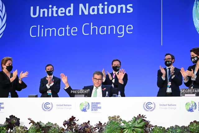 COP26 president Alok Sharma attempts to stop applause for his efforts as the summit ended in glasgow on Saturday amid what he called 'deep disappointment'. Picture: Jeff J Mitchell/Getty Images