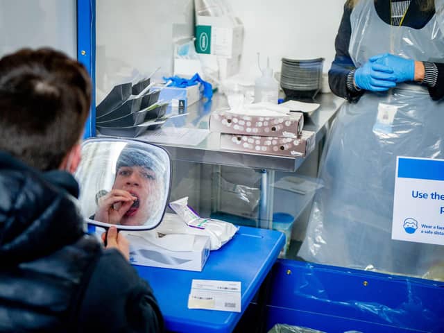 A woman taking a Covid-19 test. Photo: Adrian Dennis/AFP via Getty Images 