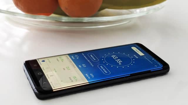 Once you've downloaded the app, and registered on it, simply stand on the scales with bare feet. Image: Renpho