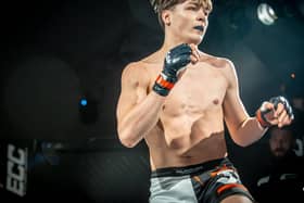 Young pro MMA fighter in action on Bolton show