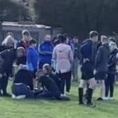Referee Dave Bradshaw is helped by onlookers after the assault at the Wigan Rose vs Platt Bridge fixture 