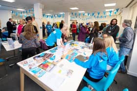 Attendees engaging with Parkinson’s UK staff and volunteers at a previous  information event