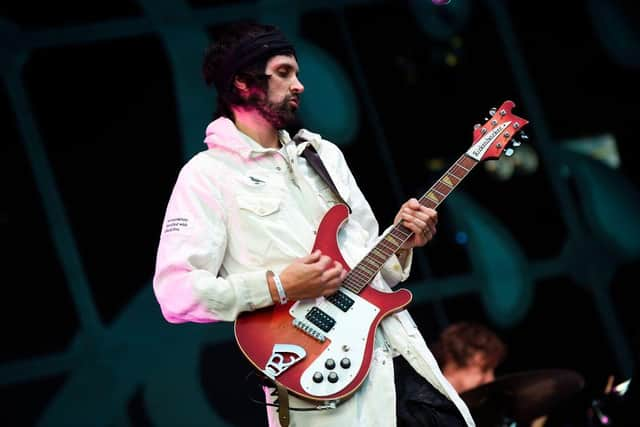 Kasabian's Serge Pizzorno on stage.