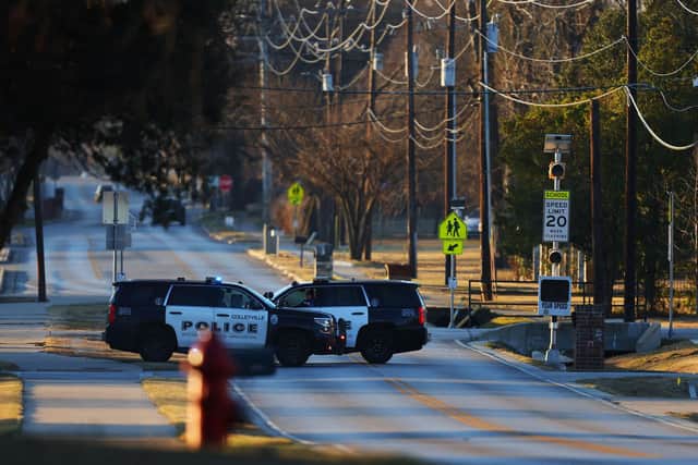 Police vehicles sit near Congregation Beth Israel Synagogue in Colleyville, Texas, some 25 miles (40 kilometers) west of Dallas, on January 16, 2022. - All four people taken hostage in a more than 10-hour standoff at the Texas synagogue have been freed unharmed (Photo by Andy JACOBSOHN / AFP) (Photo by ANDY JACOBSOHN/AFP via Getty Images)