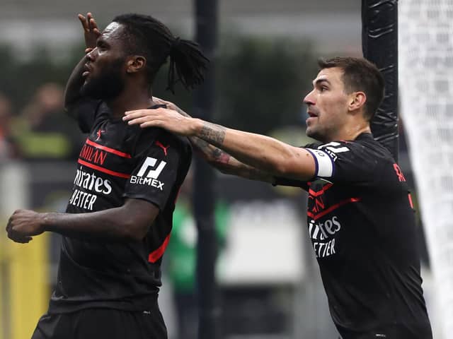 MILAN, ITALY - OCTOBER 16: Franck Kessie of AC Milan celebrates his goal with his team-mate Alessio Romagnoli during the Serie A match between AC Milan and Hellas Verona FC at Stadio Giuseppe Meazza on October 16, 2021 in Milan, Italy. (Photo by Marco Luzzani/Getty Images)