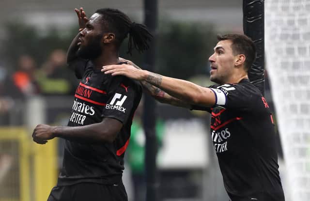MILAN, ITALY - OCTOBER 16: Franck Kessie of AC Milan celebrates his goal with his team-mate Alessio Romagnoli during the Serie A match between AC Milan and Hellas Verona FC at Stadio Giuseppe Meazza on October 16, 2021 in Milan, Italy. (Photo by Marco Luzzani/Getty Images)