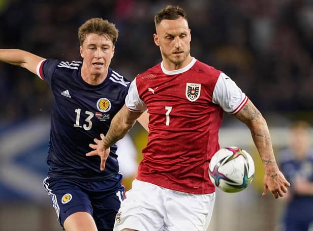 <p>Scotland defender Jack Hendry, pictured with Austria striker Marko Arnautovic, scored in Vienna on Tuesday but had several uncomfortable moments at the back. (Photo by Christian Hofer/Getty Images)</p>