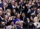 Rishi Sunak is congratulated as he arrives at Conservative party HQ in Westminster, London, after it was announced he will become the new leader of the Conservative party after rival Penny Mordaunt dropped out.