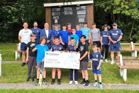 Standish cricket club recieve a cheque for £1,000