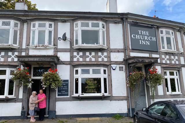May in front of The Church Inn where she was born