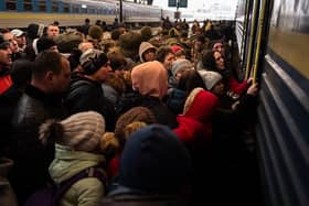 Refugees struggle to board a train at Lviv's main station, Ukraine, on March 9, 2022 Picture: Gustavo Basso/NurPhoto via Getty Images