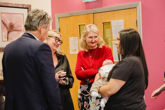 Professor Donald Peebles National Clinical Director for Maternity in England, Jane Pilkington Director of Population Health for NHS Greater Manchester and Andrea Crossfield Population Health Policy and strategy Specialist for NHS Greater Manchester, meeting with service user Alicia and her baby