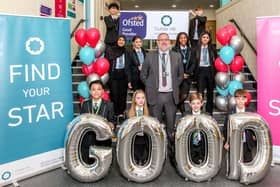 Principal Adrian Smale and pupils celebrating the result