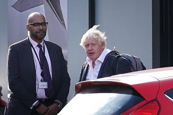 Former Prime Minister Boris Johnson arrives at Gatwick Airport in London, after travelling on a flight from the Caribbean, following the resignation of Liz Truss as Prime Minister. Picture date: Saturday October 22, 2022.