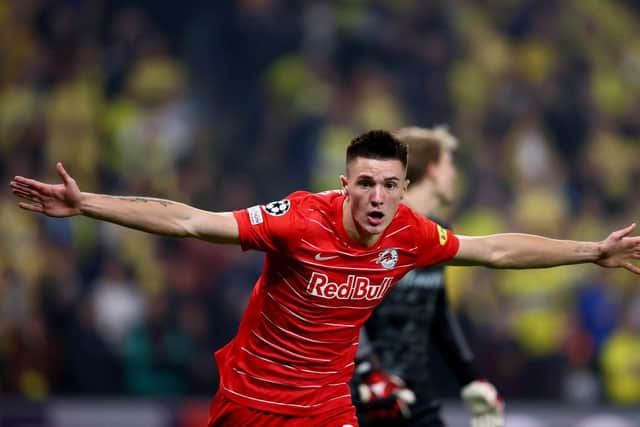 Benjamin Sesko of FC Red Bull Salzburg celebrates after he scores his team's opening goal during the UEFA Champions League Play-Offs Leg Two match between Brondby IF and FC Red Bull Salzburg at  on August 25, 2021 in Copenhagen, Denmark. (Photo by Martin Rose/Getty Images)