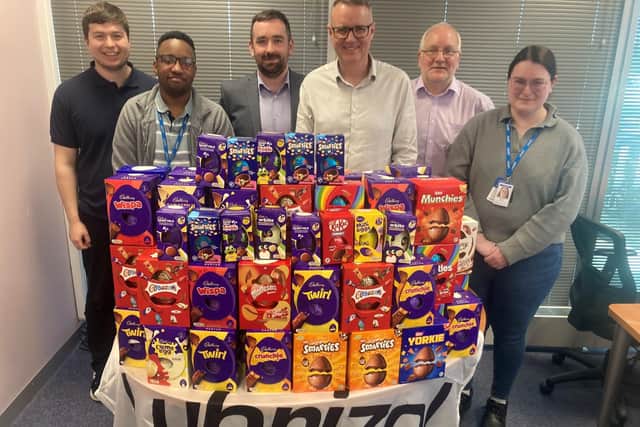 Members of the Lubrizol team with Easter eggs collected by the company for Manchester Mind