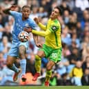 MANCHESTER, ENGLAND - AUGUST 21: Gabriel Jesus of Manchester City battles for possession with Dimitris Giannoulis of Norwich City during the Premier League match between Manchester City and Norwich City at Etihad Stadium on August 21, 2021 in Manchester, England. (Photo by Shaun Botterill/Getty Images )