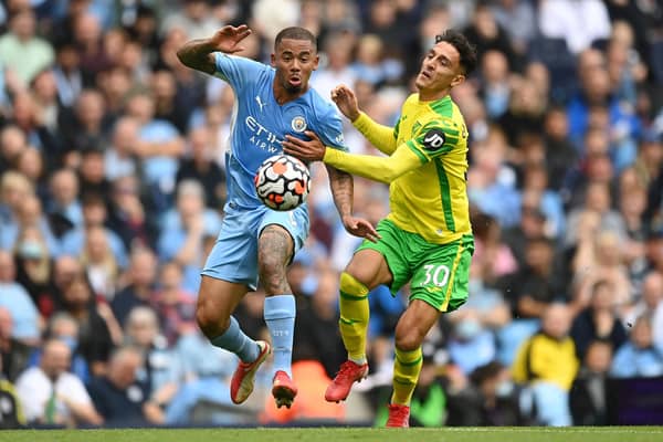 MANCHESTER, ENGLAND - AUGUST 21: Gabriel Jesus of Manchester City battles for possession with Dimitris Giannoulis of Norwich City during the Premier League match between Manchester City and Norwich City at Etihad Stadium on August 21, 2021 in Manchester, England. (Photo by Shaun Botterill/Getty Images )