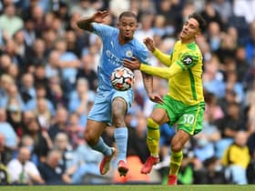 MANCHESTER, ENGLAND - AUGUST 21: Gabriel Jesus of Manchester City battles for possession with Dimitris Giannoulis of Norwich City during the Premier League match between Manchester City and Norwich City at Etihad Stadium on August 21, 2021 in Manchester, England. (Photo by Shaun Botterill/Getty Images )