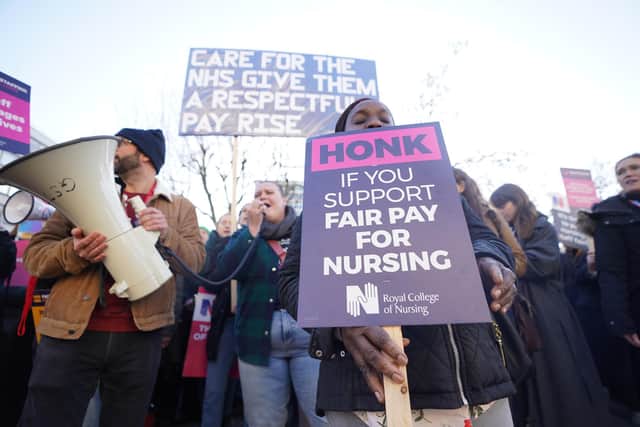 EMBARGOED TO 0001 WEDNESDAY JANUARY 18 File photo dated 20/12/2022 of members of the Royal College of Nursing (RCN) on the picket line outside St Thomas' Hospital, central London. Continued strike action plus winter pressures are jeopardising the ability of the NHS to break out of a "vicious cycle", a health leader has said. Issue date: Wednesday January 18, 2023.