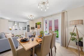 The open plan kitchen, dining and family room is destined to be the heart of the home