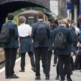 Schoolchildren awaiting the arrival of a Northern service.