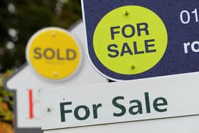 General view of estate agents signs outside a block of flats in Basingstoke, Hampshire.