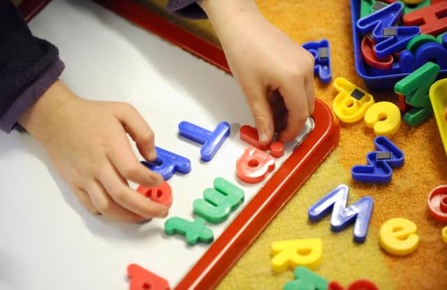 File photo dated 08/02/12 of a primary school child at work in a classroom, as almost half of children awaiting an autism assessment have been doing so for more than a year, with hundreds more waiting upwards of four years, figures show.