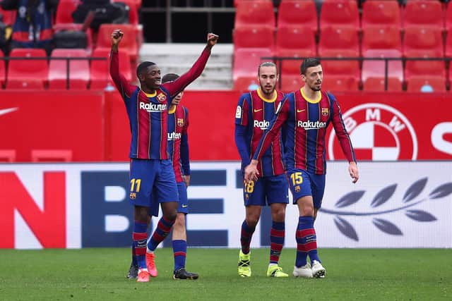 SEVILLE, SPAIN - FEBRUARY 27: Ousmane Dembele of FC Barcelona celebrates after scoring their side's first goal during the La Liga Santander match between Sevilla FC and FC Barcelona at Estadio Ramon Sanchez Pizjuan on February 27, 2021 in Seville, Spain. (Photo by Fran Santiago/Getty Images)