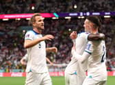 Bukayo Saka celebrates with Harry Kane and Phil Foden after scoring England's third goal against Senegal (Photo by Catherine Ivill/Getty Images)