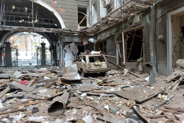 A picture shows damages in a building entrance after the shelling by Russian forces of Constitution Square in Kharkiv