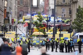 Police and emergency personnel dealing with a road traffic accident on Water Street near the Liver Building in Liverpool after a car collided with pedestrians during the Premier League winners parade. A man has been detained: Danny Lawson/PA Wire