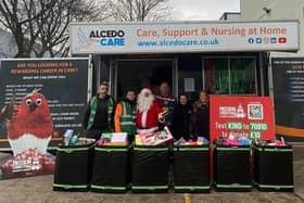 L to R Gavin Navarro, Ian McAuley, Santa, Adam Garvey, Lucy Summerton and Leah Wegener
