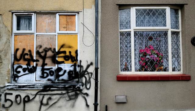A derelict house in the Cobridge area of Stoke-On-Trent, Staffordshire that is being sold by the council for Â£1 sits next to an occupied house that appears to be well looked after.