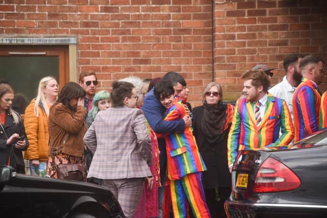 Family and friends were invited to dress "as colourful as possible" as they gathered to say their final goodbyes


