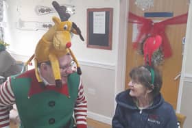 MP for Gorton and Denton and Parliamentary Under-Secretary of State for Public Health and Prevention, Andrew Gwynne with resident at HC-One’s Greatwood House Care Home creating Christmas crafts