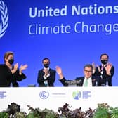 COP26 president Alok Sharma attempts to stop applause for his efforts as the summit ended amid what he called 'deep disappointment' (Picture: Jeff J Mitchell/Getty Images)