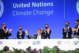 COP26 president Alok Sharma attempts to stop applause for his efforts as the summit ended amid what he called 'deep disappointment' (Picture: Jeff J Mitchell/Getty Images)