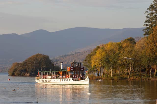 Windermere Lake Cruises vessel MV Tern glides through the autumnal beauty of Windermere and the Lake District