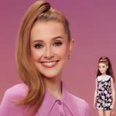 Rose Ayling-Ellis poses with the first ever Barbie doll with a behind-the-ear hearing aid