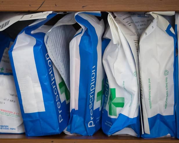 Pharmaceuticals and prescriptions awaiting collection are seen inside a independent chemist shop. 