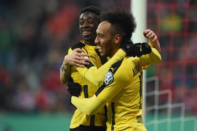 Dortmund's French midfielder Ousmane Dembele (L) and Dortmund's Gabonese striker Pierre-Emerick Aubameyang (R) celebrate after the second goal for Dortmund during the German Cup DFB Pokal semifinal football match between FC Bayern Munich and BVB Borussia Dortmund in Munich, on April 26, 2017. 

 /         (Photo credit should read CHRISTOF STACHE/AFP via Getty Images)