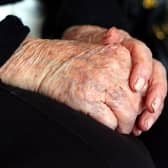 File photo dated 07/10/13 of the hands of an elderly woman at home. Councils are struggling to meet rising requests for adult social care support and some people are cutting back on their home care amid the cost-of-living crisis while "completely overwhelmed" family carers try to fill the gaps, the health watchdog has said. Issue date: Friday October 20, 2023.