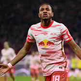 LEIPZIG, GERMANY - NOVEMBER 06: Christopher Nkunku of RB Leipzig celebrates after scoring their team's first goal during the Bundesliga match between RB Leipzig and Borussia Dortmund at Red Bull Arena on November 06, 2021 in Leipzig, Germany. (Photo by Stuart Franklin/Getty Images)