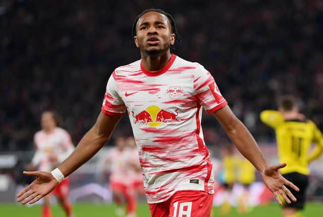 LEIPZIG, GERMANY - NOVEMBER 06: Christopher Nkunku of RB Leipzig celebrates after scoring their team's first goal during the Bundesliga match between RB Leipzig and Borussia Dortmund at Red Bull Arena on November 06, 2021 in Leipzig, Germany. (Photo by Stuart Franklin/Getty Images)