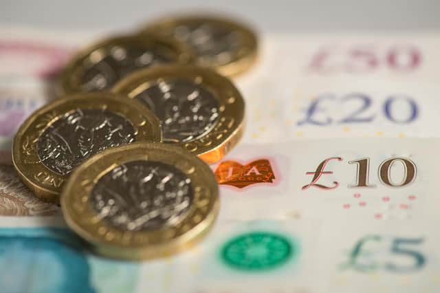 File photo dated 26/01/18 of a pile of pound coins on top of bank notes. The Pensions Regulator should be given a duty to consider the impact of the pensions sector on the wider financial system, according to the House of Lords' The Industry and Regulators Committee, which has criticised the use of leveraged liability-driven investment (LDI) strategies by defined benefit (DB) pension funds, which it said played a significant role in the financial turmoil following the mini-budget in September. Issue date: Tuesday February 7, 2023.