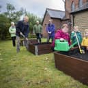 People of all ages are helping with the community garden at St John's Church in Heywood