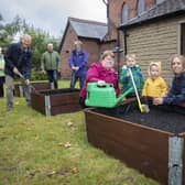 People of all ages are helping with the community garden at St John's Church in Heywood